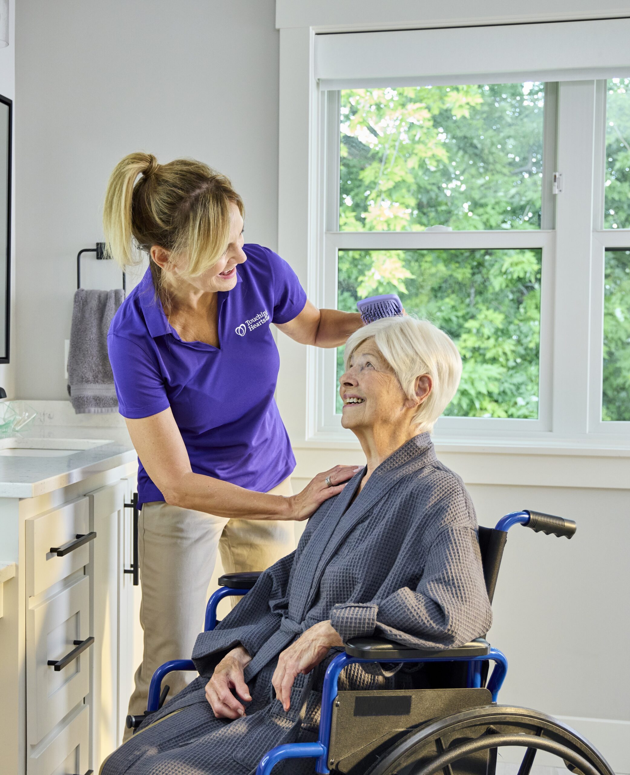 Adult daughter talking with her aging mother about home care options in their Aurora, Colorado home.