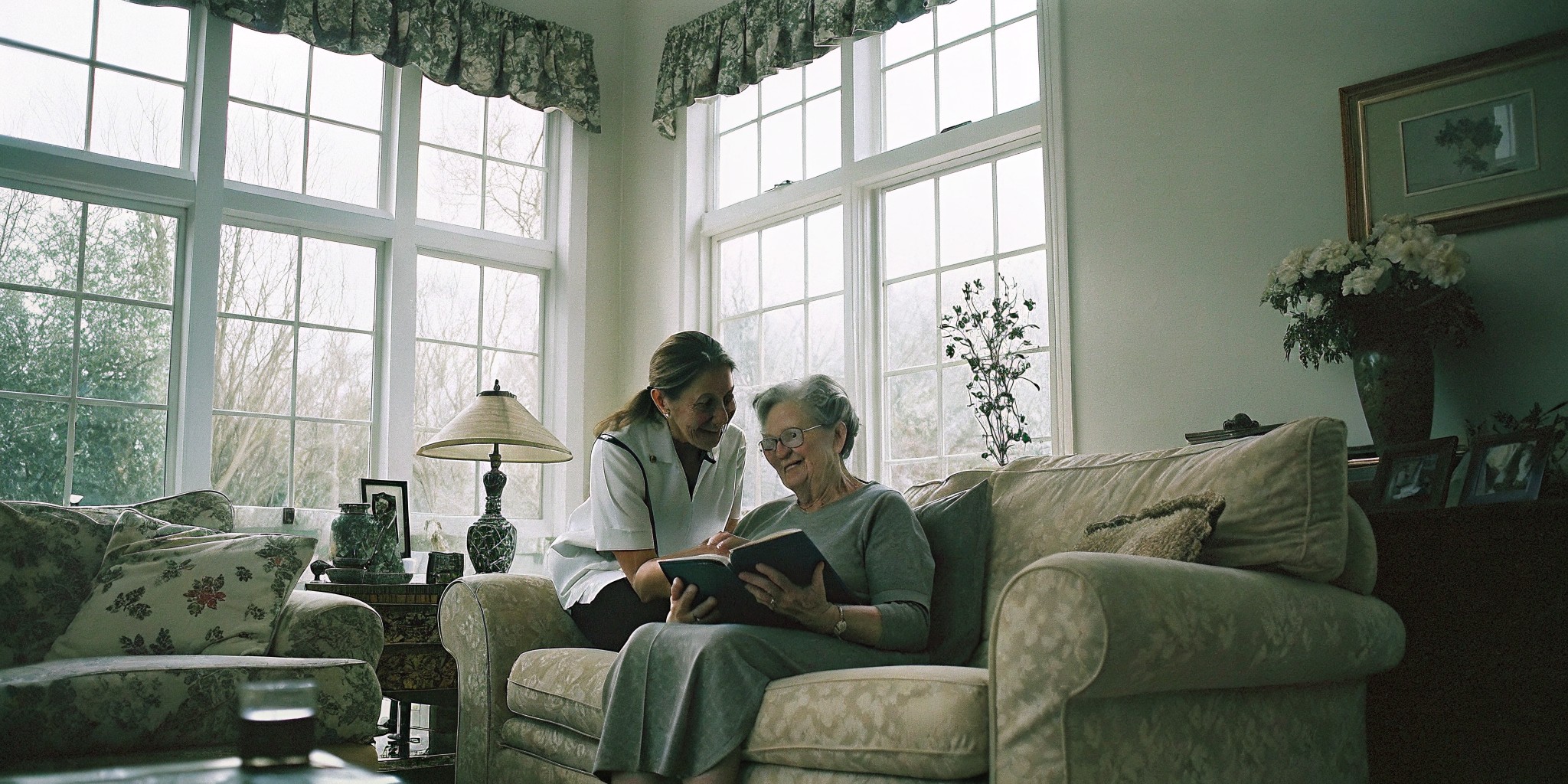 Compassionate home caregiver sitting with a senior client in Elizabeth, Colorado