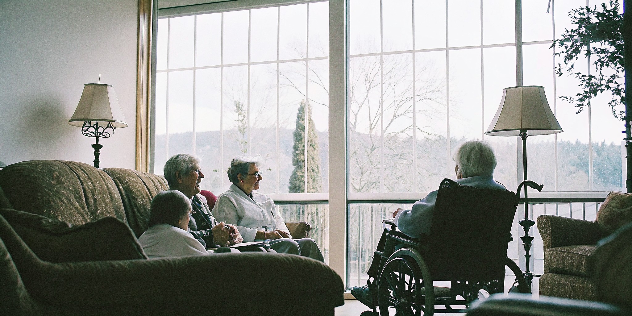 Caregiver assisting an older adult with daily activities at home in Parker, Colorado
